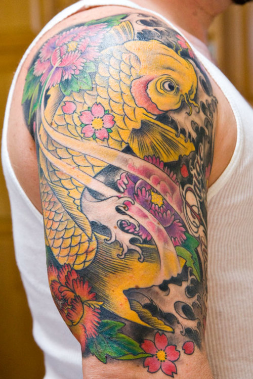 Koi fish are probably the second most powerful symbol in tattoo designs in